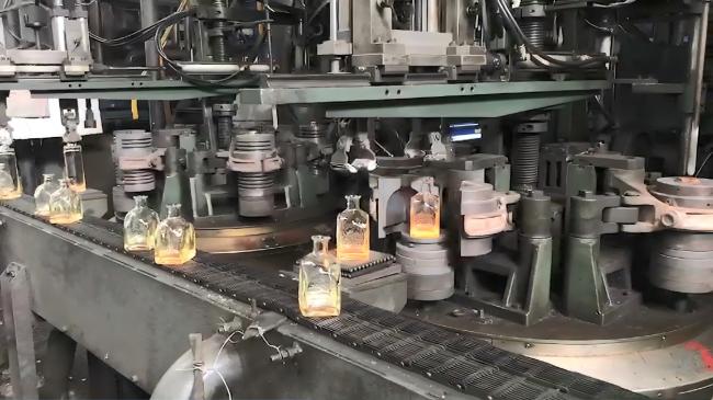 Close-up view of engraved details and embossing on glass bottle