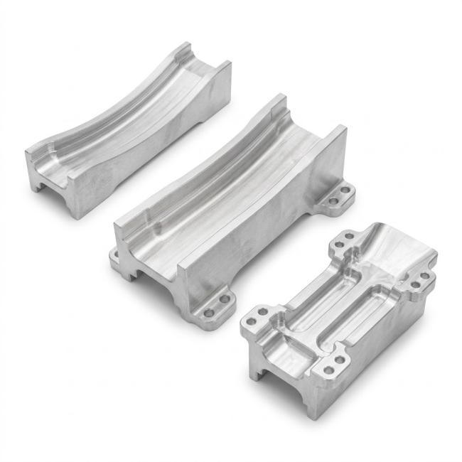 Custom CNC aluminum vibratory feeder track inserts with machined guide channels and mounting features