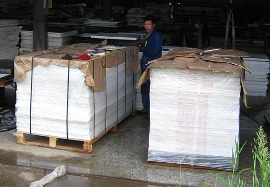 Close-up view of POM plastic sheet material and surface characteristics