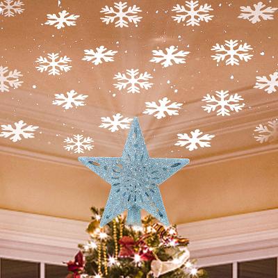 China Christmas Tree Topper Lighted Star Tree Toppers with LED Rotating Snowflake Projector Lights 3D Hollow Silver Star Snow Tree Top à venda