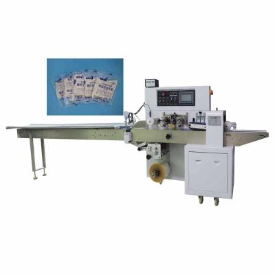 China Customized Automatic Pillow Packing Machine 2.8KW Gloves Packaging Machine for sale
