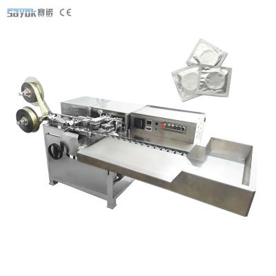 China Full Automatic Packing Machinery Fast Speed Wrapping Condom Bag Packing Machine for sale