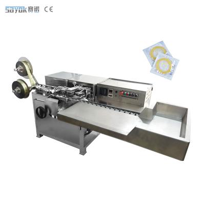 China 2.5KW Full Automatic Packing Machinery Natural Rubber Latex Bulk Condom Sealing Foiling Machine for sale