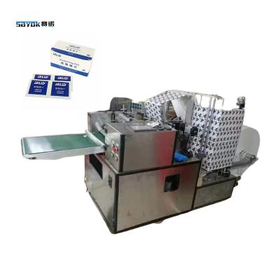 China Dose Liquid Pump Filling Alcohol Swabs Packing Machine Prep Pad Making Machinery for sale