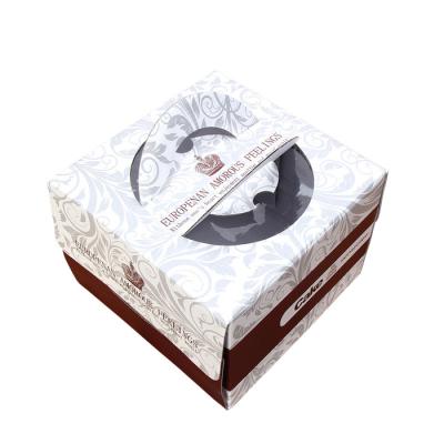 中国 ハンドルが付いている注文の贅沢な段ボールのケーキ箱の卸し売り印刷 販売のため