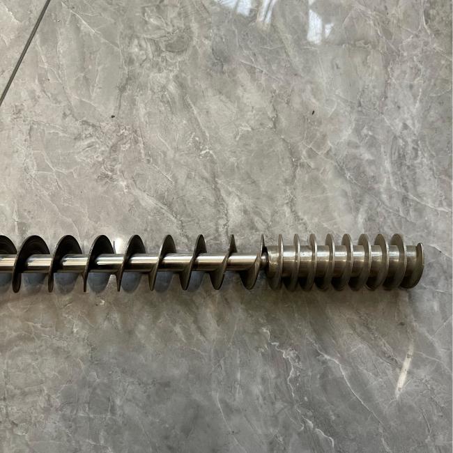 Close-up view of conveyor spiral blade