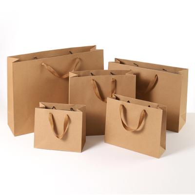 China Custom Cardboard Packaging White Brown Kraft Gift Craft Shopping Paper Bag With Handles Printed Your Own Logo for sale