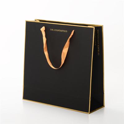 China Luxury Hot Stamping Printed Paper Shopping Bags With Ribbon Handle Custom Size for sale