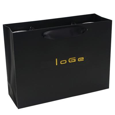 China Custom Luxury Black Garment Packaging Paper Bag With Satin Ribbon Rope for sale