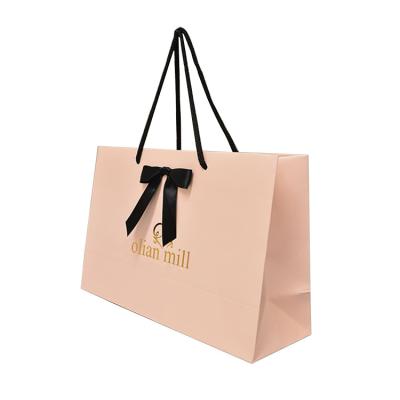 China Custom Logo Printed Paper Pink Jewelry Packaging Gift Bag With Ribbons for sale