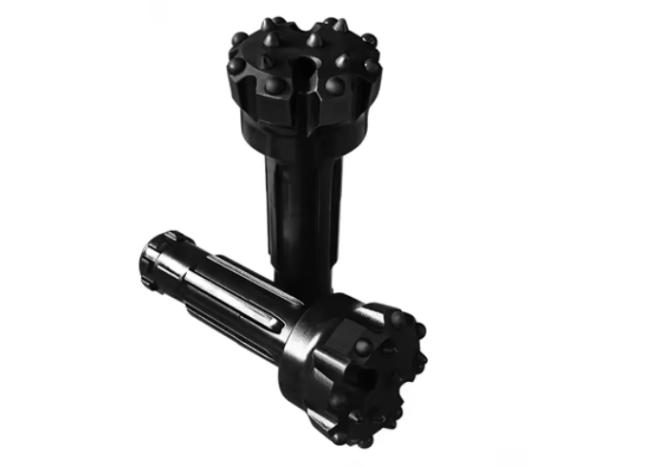 Side view of water well drill bit showing alloy cutting edges