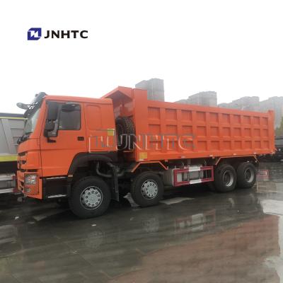 中国 HOWO 8x4 371hp 27M3 12の車輪の自己のタンザニアのための負荷のダンプ トラック 販売のため