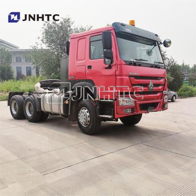 中国 使用されたトラクターの頭部のトレーラーは95のKm/h 6x6 30トンのHowoのトラクターのトラックのトレーラーの頭部を使用した 販売のため