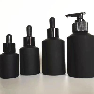 China Black Essential Oil Serum Slip Shoulder Glass Dropper Bottle With Screw Cap for sale