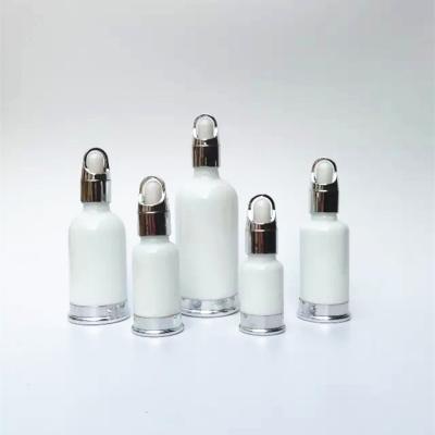 China Garrafa de vidro vazia luxuosa do soro do óleo da cara de 15ml 30ml que empacota a garrafa cosmética da bomba à venda