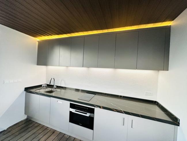 Minimalist Stainless Steel Outdoor Kitchen Cabinet Units With Black Quartz Countertops Island - Contemporary with feature detail