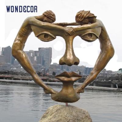 China Large Abstract Casting Bronze Face Sculpture Brass Color Decoration for sale
