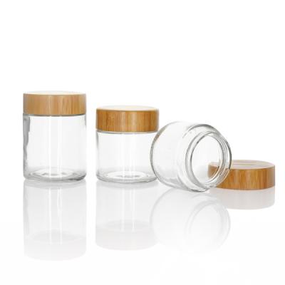 China 3oz Child Resistant Wooden Lid Glass Jars With Bamboo Lid Storage Jar Container Cosmetic for sale