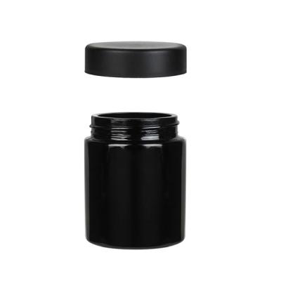 China Round Children Proof Black Jars 2 Oz Jars With Lids Child Resistant Opaque Black Glass for sale