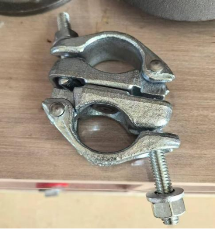 British type swivel coupler for scaffolding connecting pipes at any angle