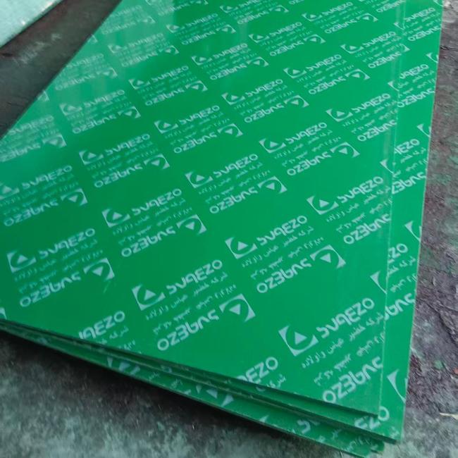 Green Plastic Film Faced Plywood Sheet showing smooth surface and construction application