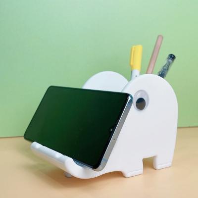 China Elefante en forma de goma de silicona soporte para teléfono móvil portalápices en venta