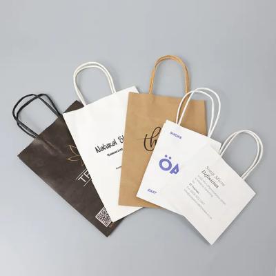 China Large Brown Paper Tote Bags Wholesale With Rope Handle Recyclable Retail White Colorful for sale