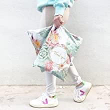 Girl walking holding thank you poly mailer
