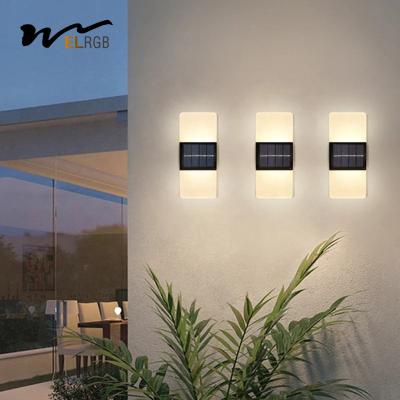 China Acrílico Led Pared exterior Sconce LED Luces de energía solar Luz blanca fría en venta