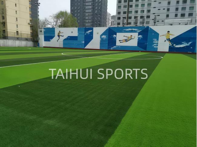 Completed artificial turf installation with shock pad underlay