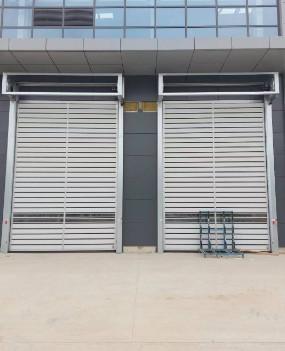 China Wind Resistance Industrial Spiral Hard Fast Door High Frequency Opening And Closing for sale