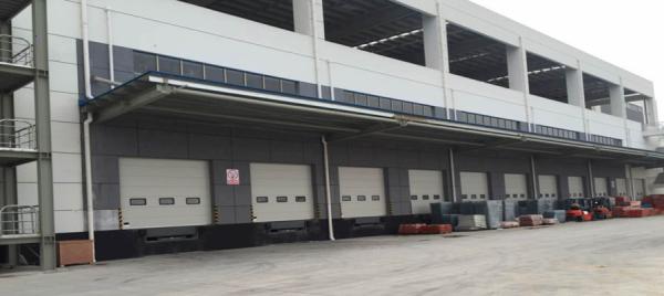 Quality Automatic Steel Industrial Sectional Doors 24dB Sound Insulation 450N/M2 Wind Load for sale