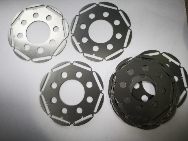 High-Precision Rotor Laminations with inclined slot design, showcasing low loss, high efficiency, and stable magnetic performance