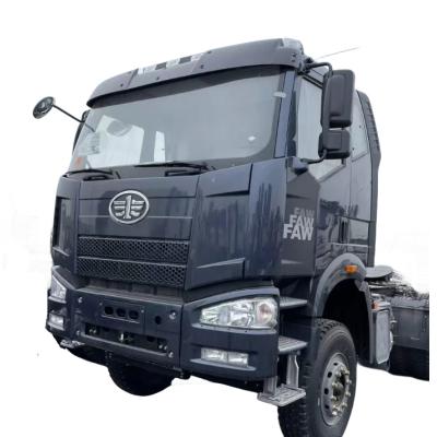 China Heavy truck tow head FAW JH6 prime mover / 9 11 13 liters engine towing tractor truck for sale