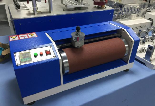 Technical diagram of DIN Abrasion Tester components and measurements