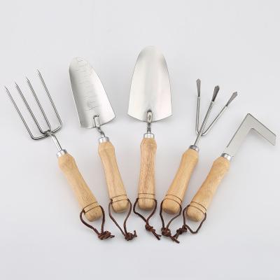 China Mão de madeira de aço inoxidável ferramentas de jardim de mão de cinco peças à venda