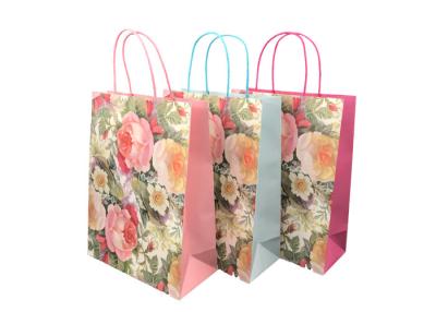 China Exquisite Sustainable Promotional Paper Gift Bags Flower Pattern Design for sale