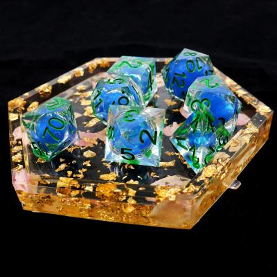 China Transparent blue liquid natural resin desktop game dice set dnd dice for sale