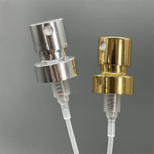 Golden perfume spray pump atomizer front view showing elegant design