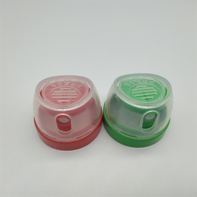 Close-up view of aerosol cap demonstrating full actuator coverage