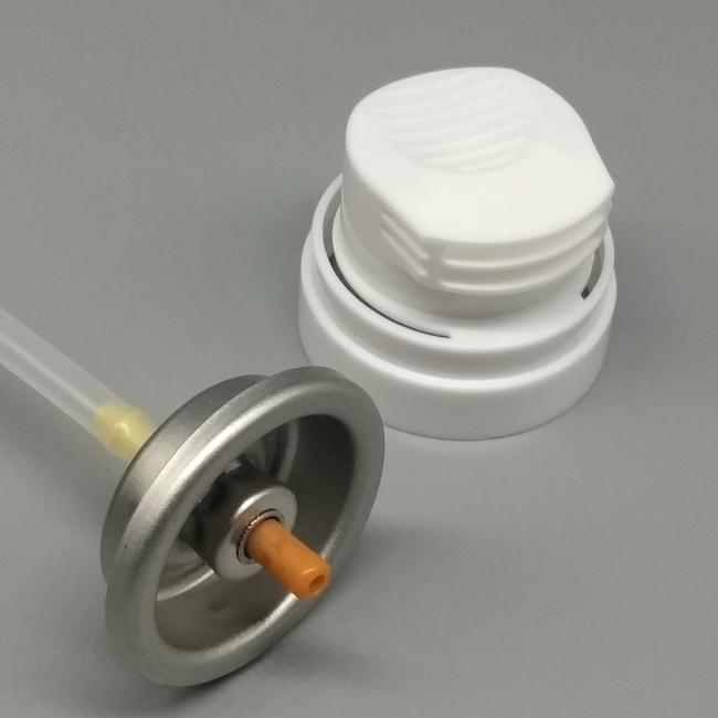 Close-up of shaving foam valve showing dispensing nozzle