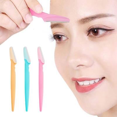 中国 OEMの眉毛かみそりの額のトリマーの構造の電気かみそりは安全な形成の設計ナイフの顔の毛の除去剤のピンクの黄色に用具を使う 販売のため