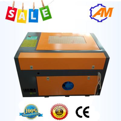 Китай Лазер CNC СО2 гравируя автомат для резки для пластиковой бумажной древесины MDF акриловой продается