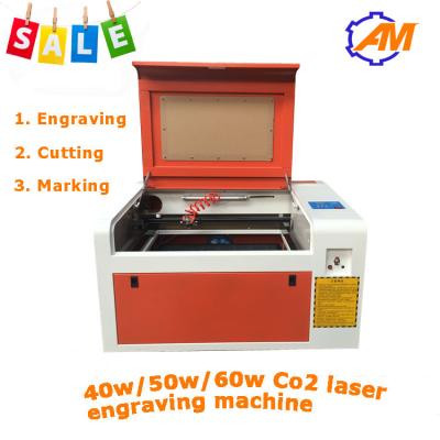 China Mini laser del CO2 que graba al grabador For Acrylic de la cortadora 40W en venta