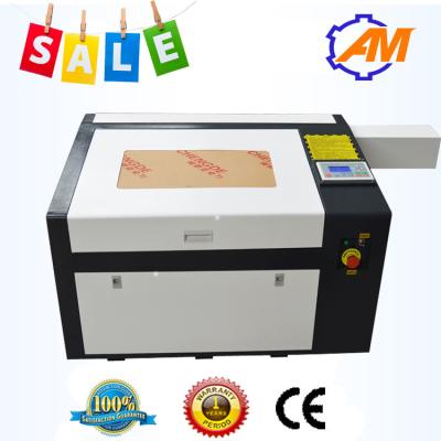 China Grabador de cuero de acrílico del laser 60W del arte del paño de la ropa de la cortadora del laser del CO2 del CNC en venta