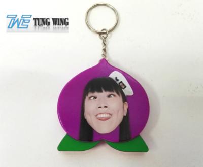 中国 かわいい紫色のモモの定形音楽的なキーホルダー、注文の話す Keychain 販売のため