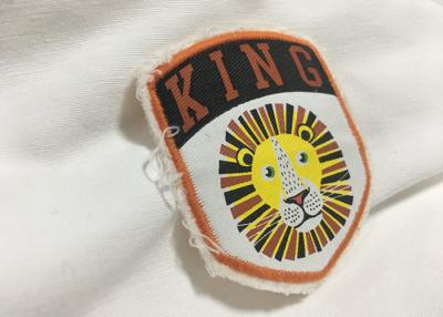 China Merrow Border Custom Stitched Patches , Clothing Iron On Embroidered Patches For T Shirts for sale
