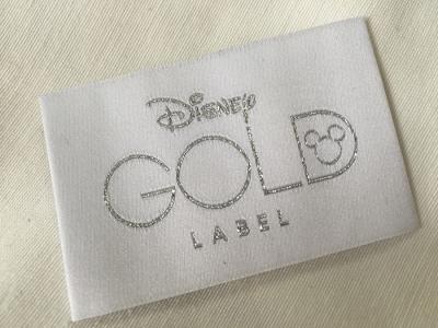 China Disney Gold Bage End Fold Woven Clothing Labels Cold Cut / Heat Cut for sale