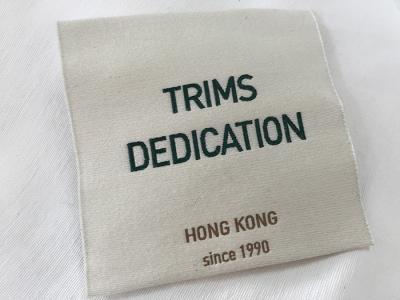 China Cotton Thread Brocade Woven Clothing Labels Beige Background High Density for sale