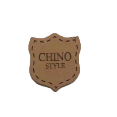 China Cowboy Clothing Logo Badges Heat Press Emboss Genuine Leather Patches For Jeans for sale
